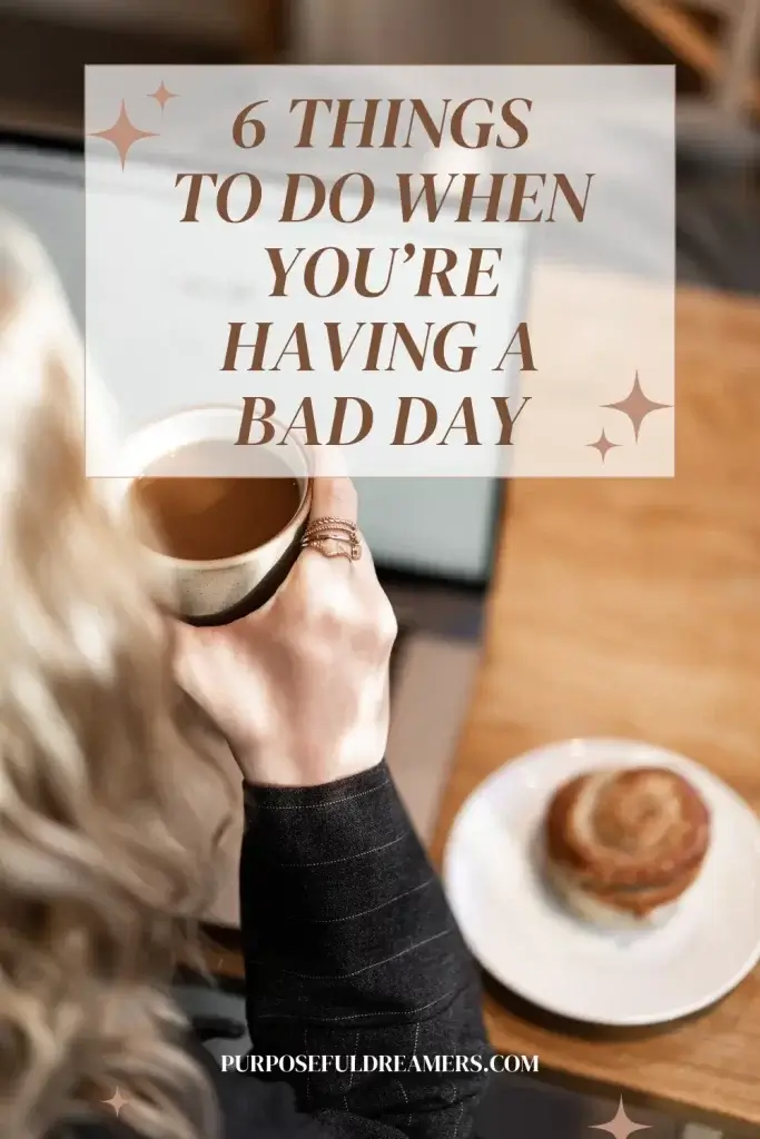 Woman drinking a hot coffee at a café  trying not to have a bad day