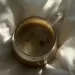 Cup of Coffe on a Bed